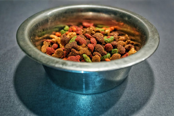 pet food in scoop on weighing scale tray