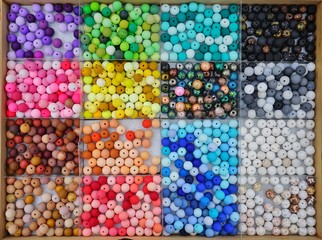 Colorful beads in rectangular containers
