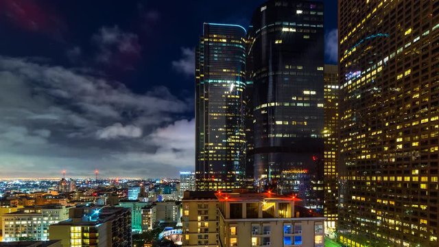 Timelapse of Clouds over City Lights in Downtown Los Angeles -Tilt Down-