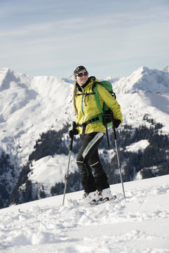Female backcountry skier, mountain range in background, Alpbachtal, Tyrol, Austria, Europe