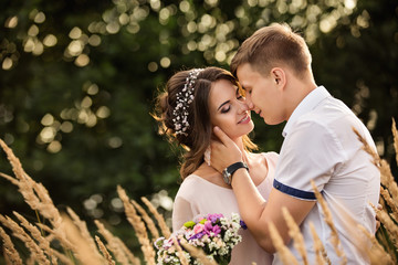 Fototapeta premium Couple in love embracing in park. Toned photo