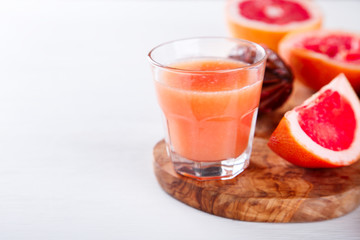 Juice on a White Background.Grapefruit. Breakfast.Food or Healthy diet Concept.Copy space for Text. selective focus.