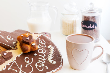 Romantic Valentine´s Day breakfast, snack. Cup of chocolate and heart shaped chocolate cookies.