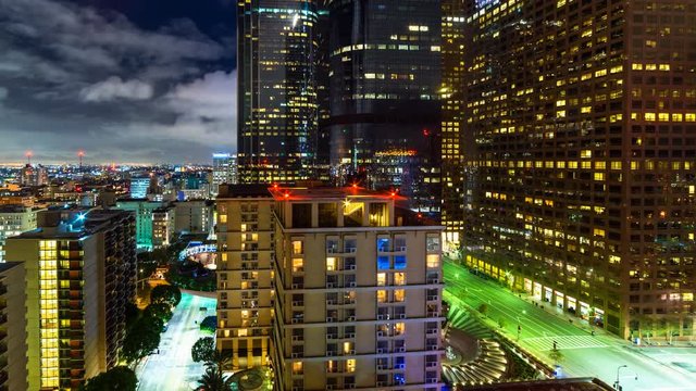 Timelapse of Clouds over City Lights in Downtown Los Angeles -Pan Left-