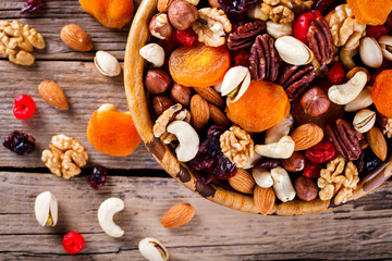 Nuts and dried fruit mix. Concept of Healthy Food. Vintage wooden background. selective focus