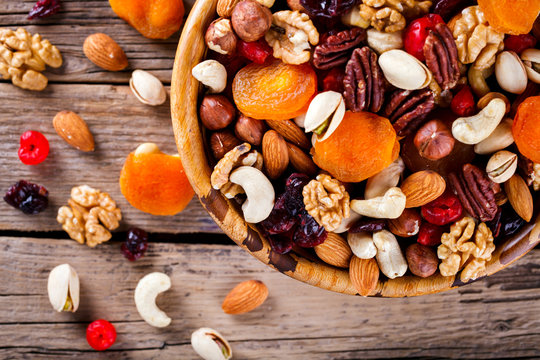 Nuts and dried fruit mix. Concept of Healthy Food. Vintage wooden background. selective focus