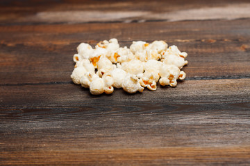 Fototapeta na wymiar popcorn on a wooden background