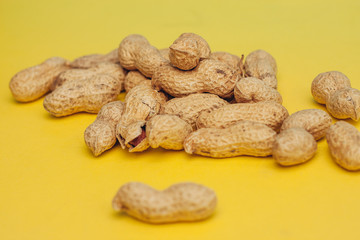 yellow background and inshell peanuts