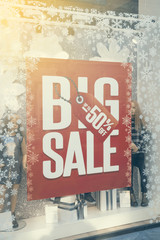 Sale sign in shop window, discount sale sign 2