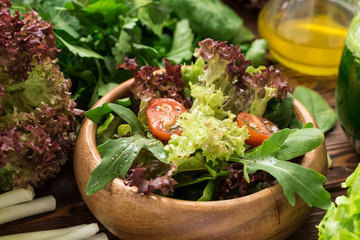 Fresh salad from greens, cherry tomatoes and spices