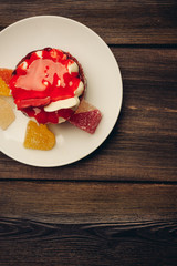 cake in a plate and marmalade top view