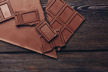 broken chocolate on a wooden table