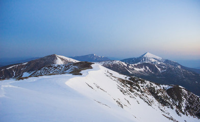 magical winter snow covered tree. Sunset in the Carpathians. Ukr