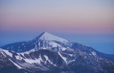 magical winter snow covered tree. Sunset in the Carpathians. Ukr