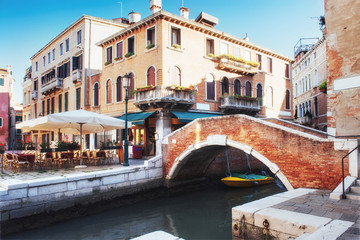 Fototapeta na wymiar Gondolas on canal in Venice. is a popular tourist destination of Europe