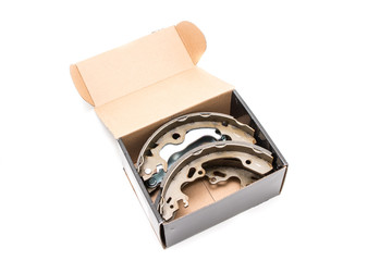 New car's break shoes kit in the box on the white background