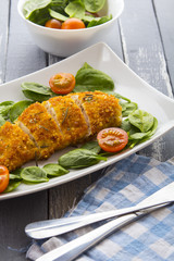 Food fried breading chicken spinach salad tomatoes pancakes from potatoes
