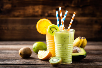 orange and green smoothies with exotic fruits, healthy eating, superfood