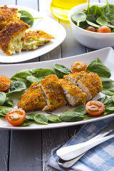 Food fried breading chicken spinach salad tomatoes pancakes from potatoes
