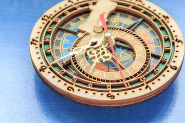 Fototapeta na wymiar Colorful vintage clock with zodiac signs on it