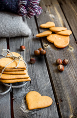 Valentines day heart shaped cookies and glass of milk.