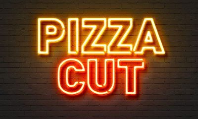 Fototapeta na wymiar Pizza cut neon sign on brick wall background.