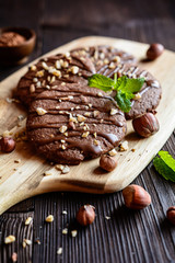 Delicious chocolate cookies with hazelnuts and topping