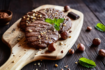 Delicious chocolate cookies with hazelnuts and topping