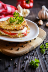 Cauliflower fritters stuffed with Mozzarella cheese and bell pepper slices