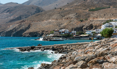 Fototapeta na wymiar Rocky coastline of Crete island near Chora Sfakion town, located in southern part of island