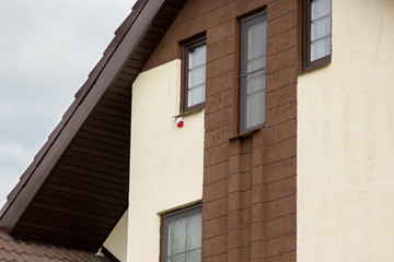 sound and light security device on wall