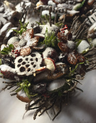 Design a bunch of twigs and dried fruit in the snow