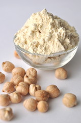Chickpea flour and chickpeas isolated on white. Alternative gluten-free flour for baking and cooking. 
