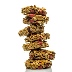 Kozinaki, briquettes of sunflower seeds, candied sugar, caramel or honey isolated on white background