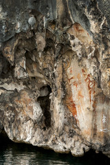 Prehistoric petroglyph rock paintings in Raja Ampat, West Papua, Indonesia. Aborigines from Australia left their markings in the form of rock paintings around Misool Island. 3,000 to 5,000 years old.