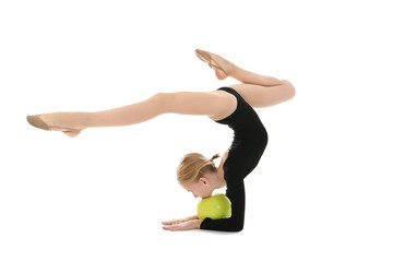 Young girl doing gymnastic exercise with ball, isolated on white