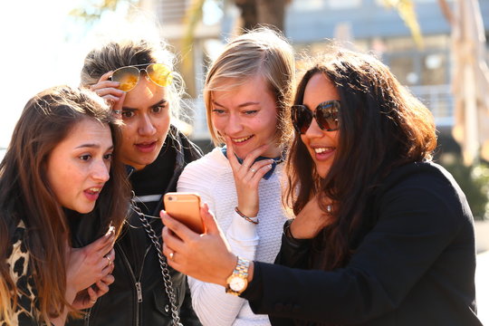 surprise/ girls being surprised at the message they read on their mobile phone