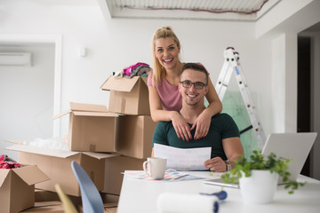 Young couple moving in a new home