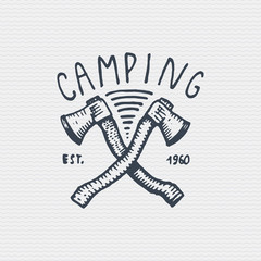 vintage old logo or badge, label engraved and old hand drawn style with two axes