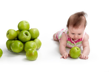 Baby with green apple