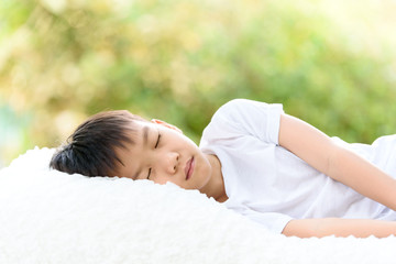 Obraz na płótnie Canvas Boy sleep on bed