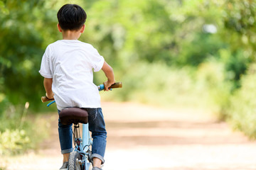 Young boy ride bicycle