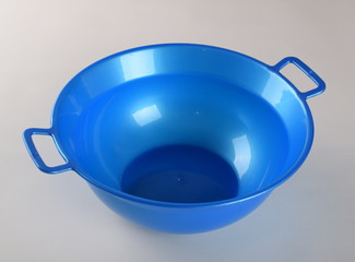 Blue deep plastic bowl with handles isolated on white background