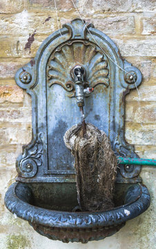 Old cast iron fountain at the wash house of Grottammare, Marche, Italy
