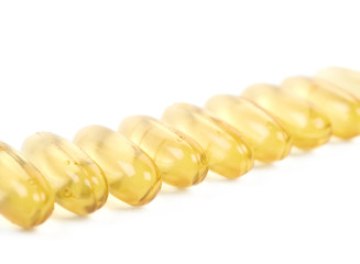 Line of softgel pills isolated