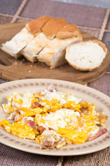 Fried eggs with bacon served on the table