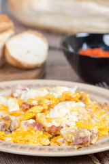 Fried eggs with bacon served on the table