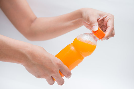 open bottle caps of orange juice