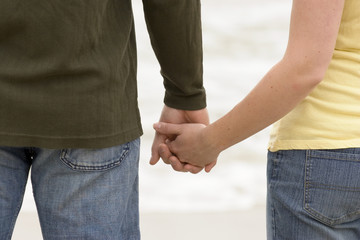 Couple share romantic moments on the beach.