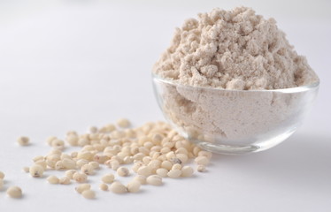 Sorghum grains and flour - alternative gluten-free flour. Isolated on white